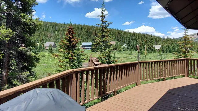 a view of a balcony with wooden floor