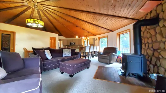 a outdoor living space with furniture and a flat screen tv