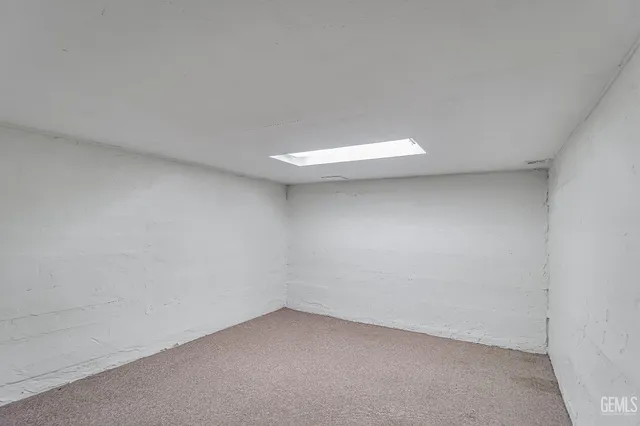 a view of a house with a yard and garage