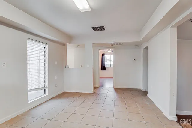 a kitchen with a refrigerator and window