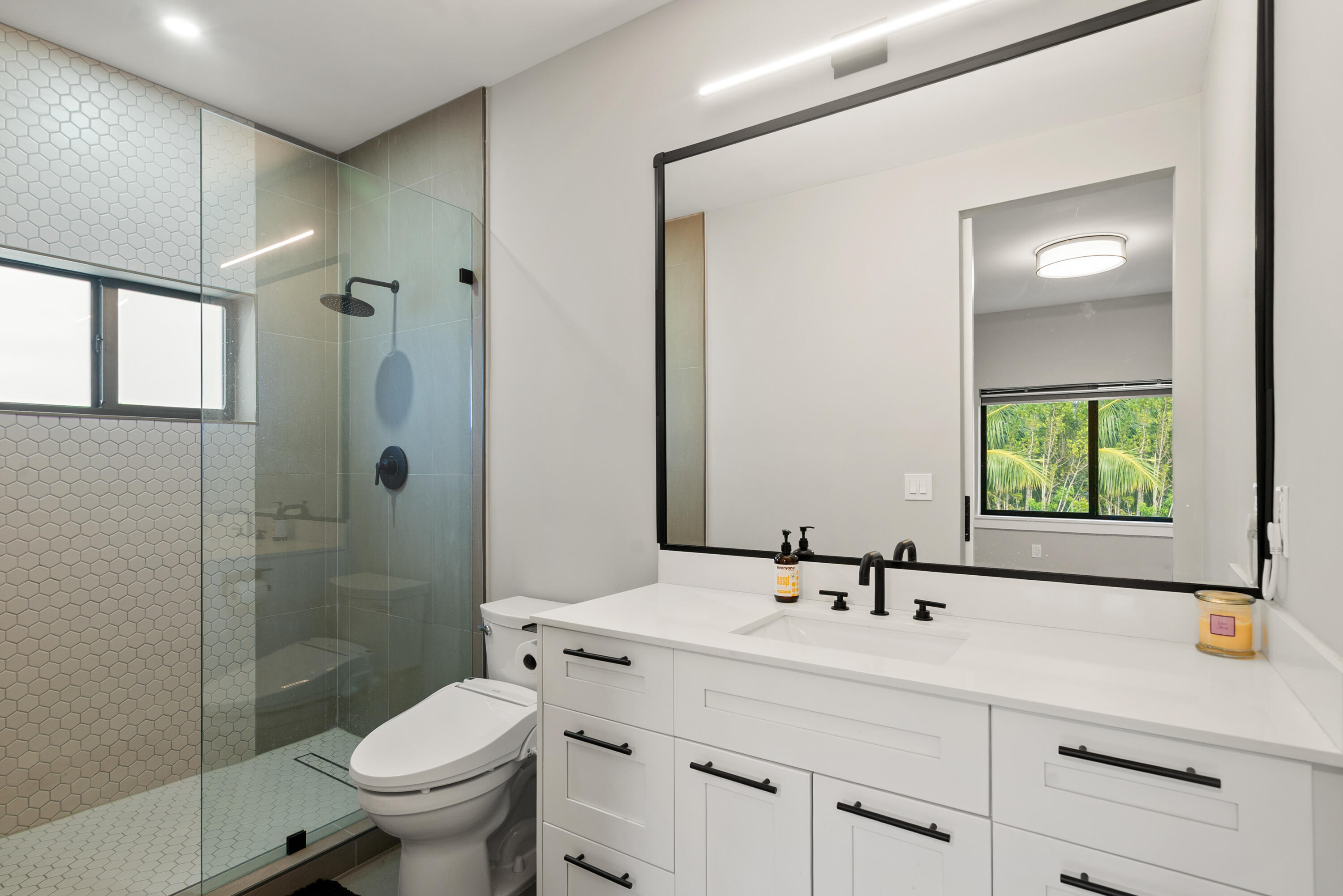 13 Coral Way Key Largo, FL 33037 - Photo 19 of 34 a bathroom with a sink toilet and shower
