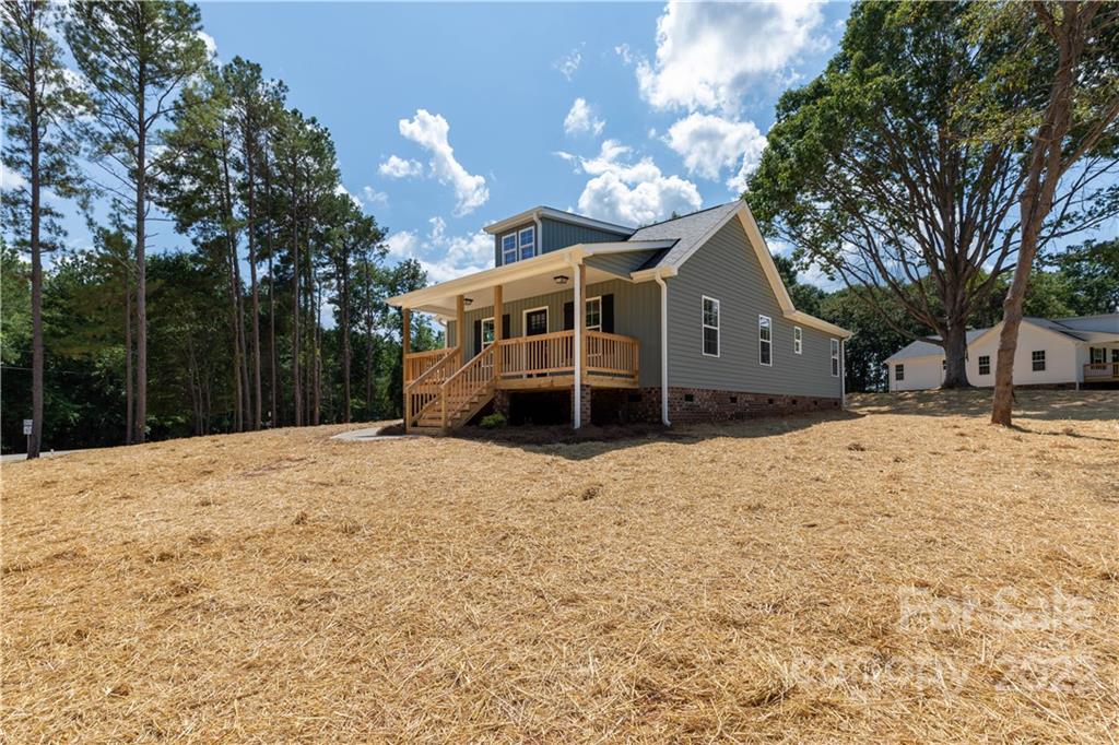 6184 Hopewell Road Hickory Grove, SC 29717 - Photo 14 of 30 a front view of a house with a yard covered in snow
