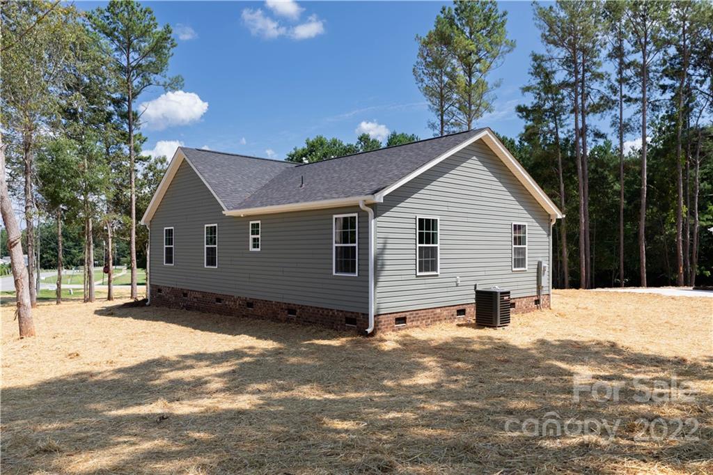 6184 Hopewell Road Hickory Grove, SC 29717 - Photo 17 of 30 a view of a house with a yard covered in snow