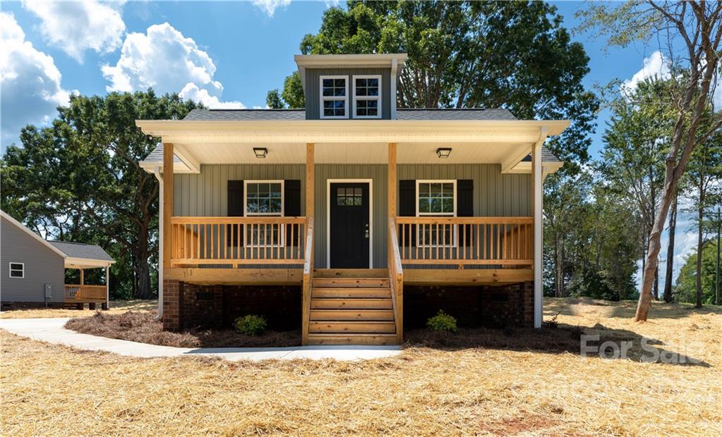 6184 Hopewell Road Hickory Grove, SC 29717 - Photo 3 of 30 a front view of a house with a yard with a house