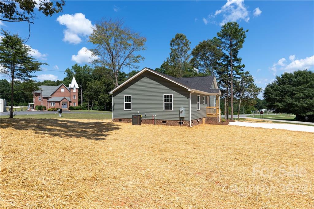 6184 Hopewell Road Hickory Grove, SC 29717 - Photo 5 of 30 a view of a house with a yard and covered with snow