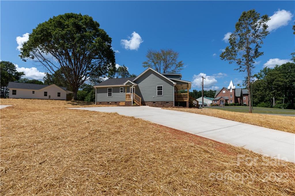 6184 Hopewell Road Hickory Grove, SC 29717 - Photo 10 of 30 a view of house with yard and trees in the background