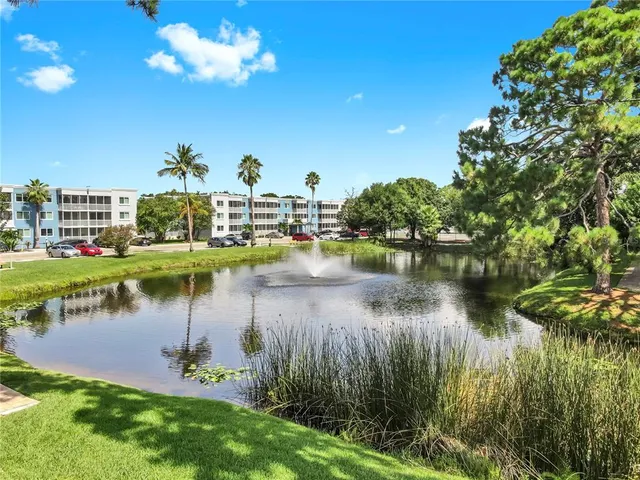 a view of a lake with a house in the background