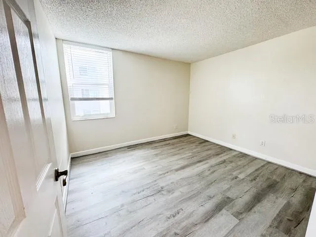 an empty room with a empty space and a window