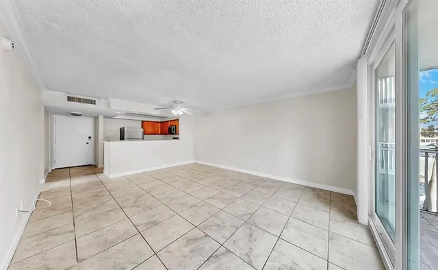 a view of a big room with closet and windows