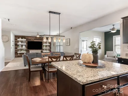 a kitchen with a counter top space and a living room