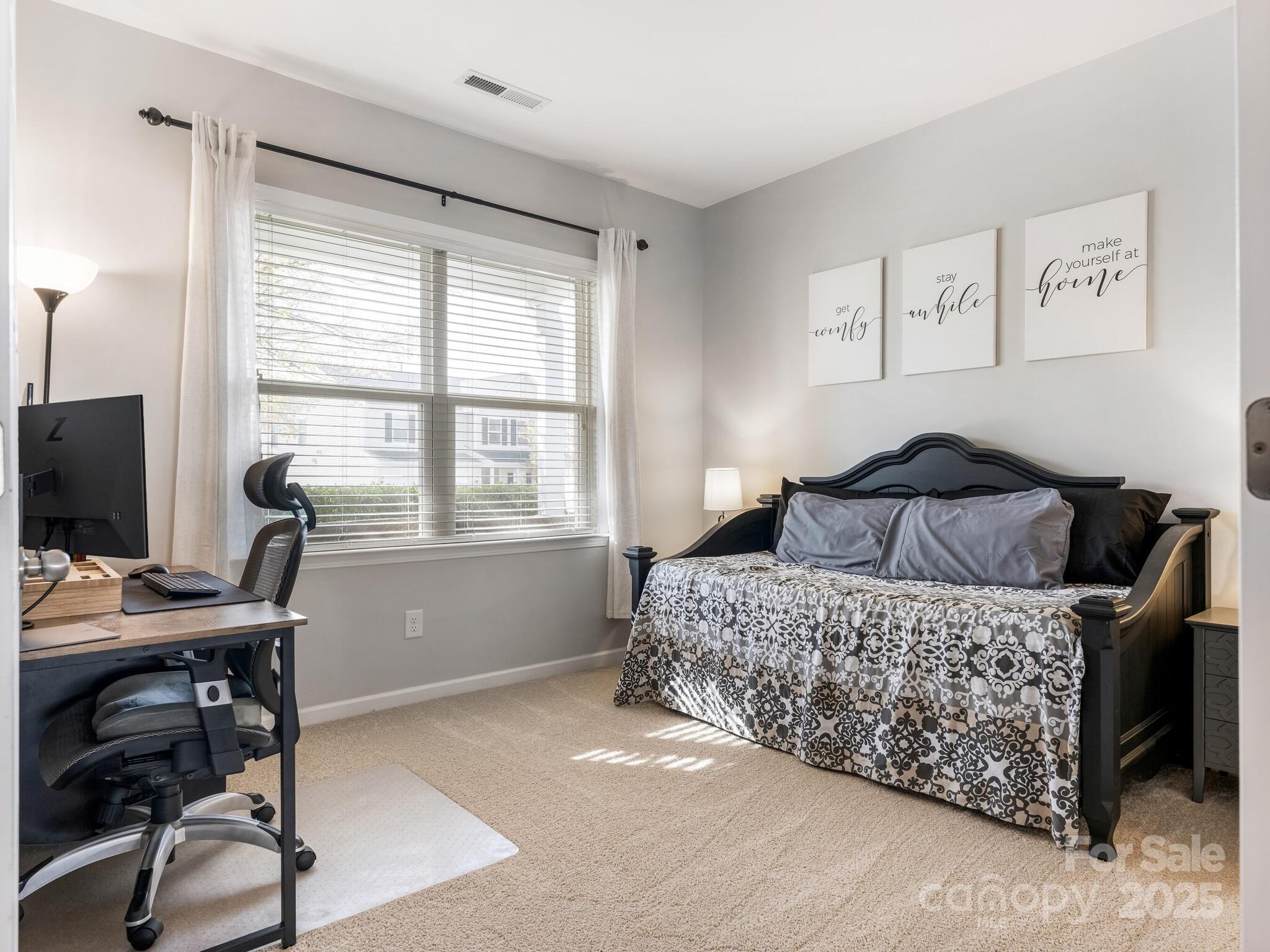 13118 Great Laurel Road Charlotte, NC 28227 - Photo 15 of 38 a bedroom with a bed and a desk