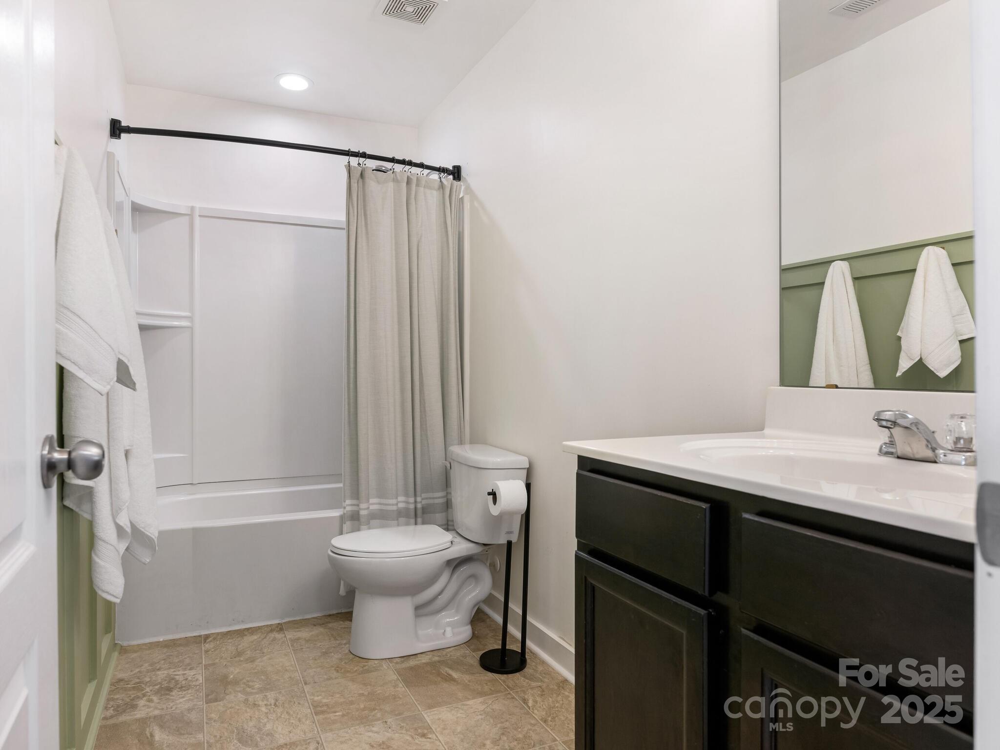 13118 Great Laurel Road Charlotte, NC 28227 - Photo 27 of 38 a bathroom with a granite countertop sink toilet and shower