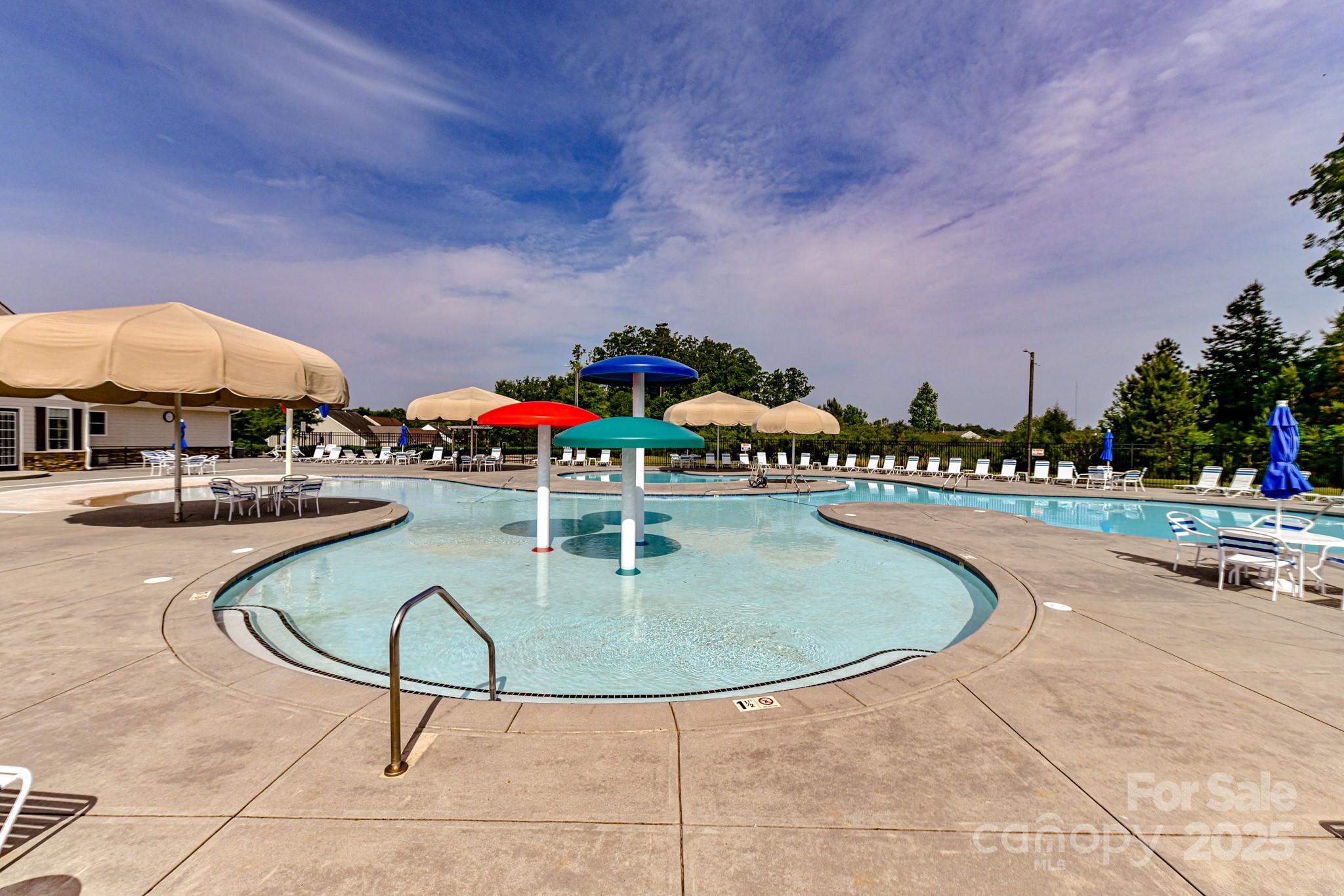 13118 Great Laurel Road Charlotte, NC 28227 - Photo 32 of 38 a swimming pool with outdoor seating and yard in the back