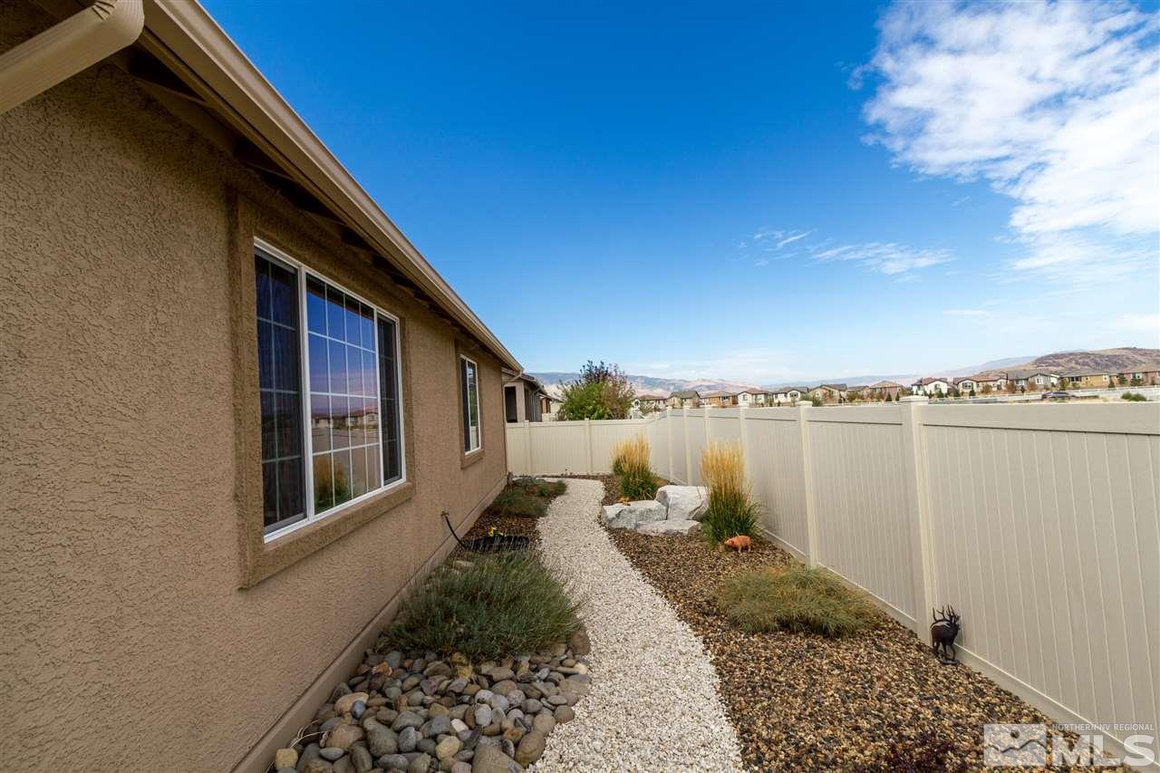 2285 Makenna Drive Reno, NV 89521 - Photo 19 of 24 a backyard of a house with lots of green space