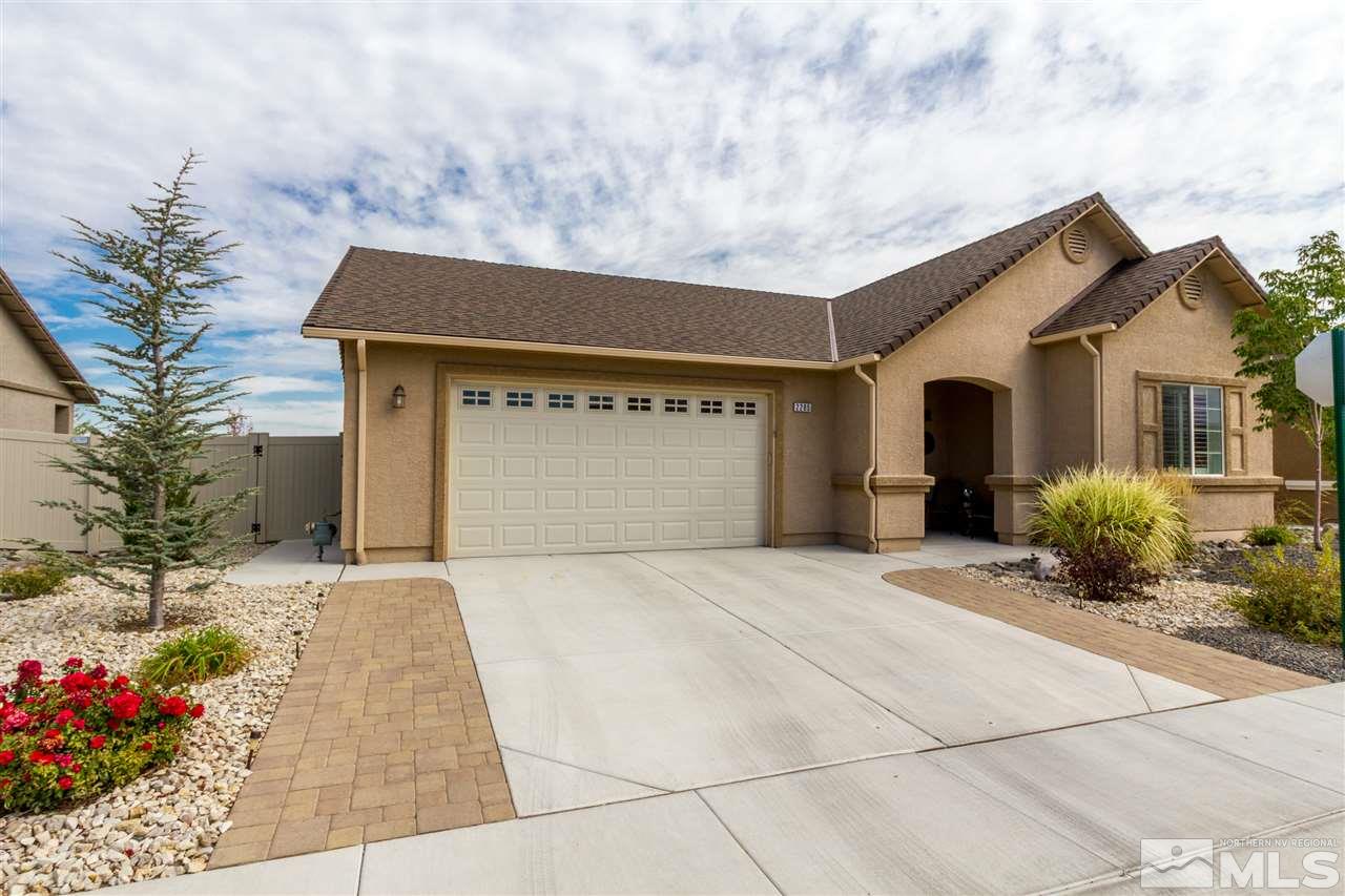 2285 Makenna Drive Reno, NV 89521 - Photo 2 of 24 a front view of a house with a yard and garage