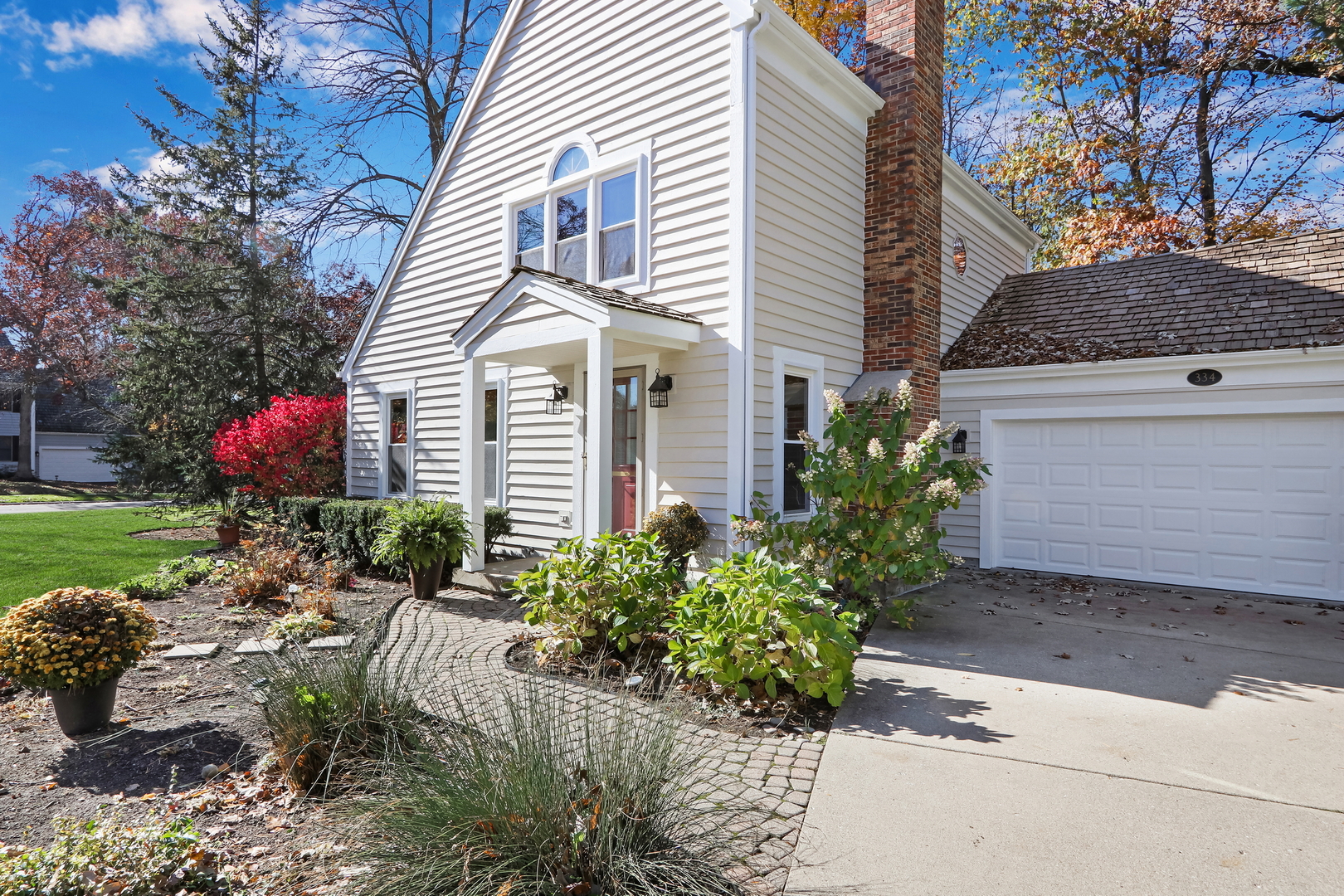 334 Concord Square Gurnee, IL 60031 - Photo 3 of 32 a front view of a house with a yard and a garage