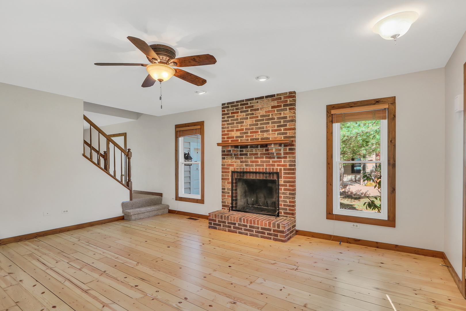 334 Concord Square Gurnee, IL 60031 - Photo 6 of 32 a view of empty room with fireplace and wooden floor