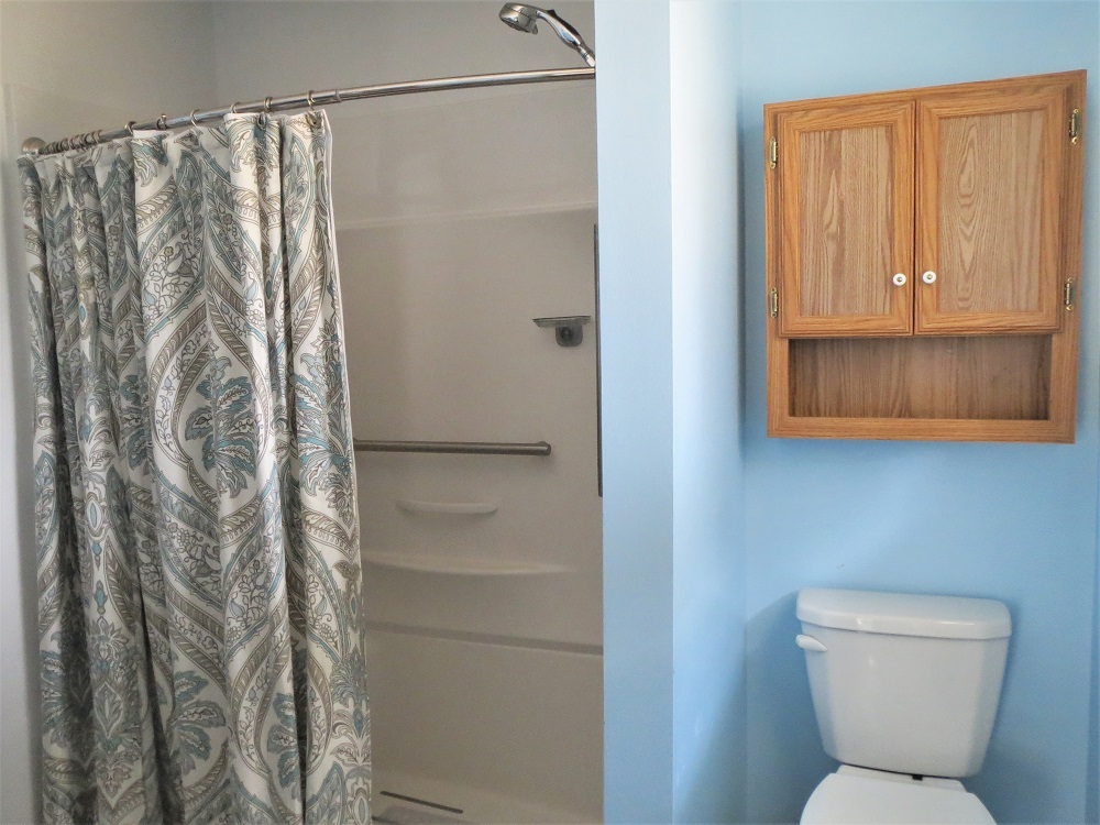 2086 Peek Home Road Dixon, IL 61021 - Photo 16 of 30 a bathroom with a toilet and a shower curtain
