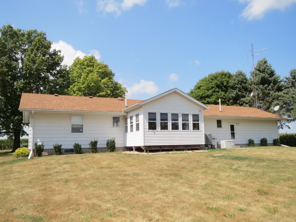 2086 Peek Home Road Dixon, IL 61021 - Photo 28 of 30 a front view of a house with a yard and trees