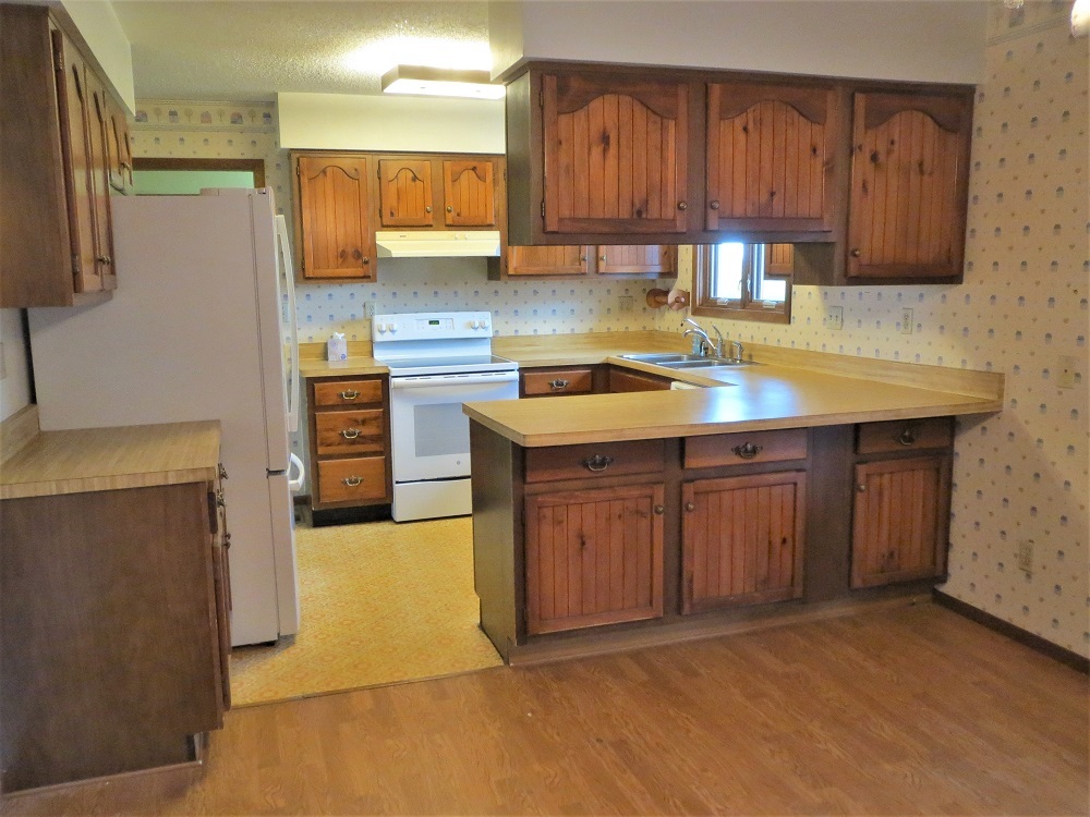 2086 Peek Home Road Dixon, IL 61021 - Photo 6 of 30 a kitchen with stainless steel appliances granite countertop a sink stove and cabinets