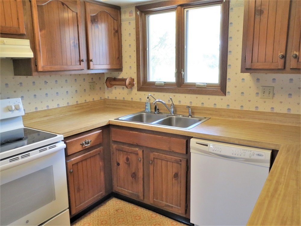 2086 Peek Home Road Dixon, IL 61021 - Photo 7 of 30 a kitchen with a sink cabinets and window