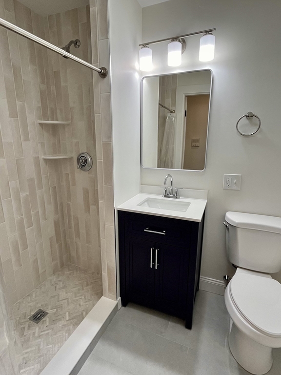 374 A Centre Street, Unit 2 Boston, MA 02130 - Photo 5 of 10 a bathroom with a sink and a mirror