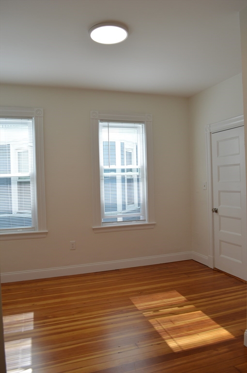 374 A Centre Street, Unit 2 Boston, MA 02130 - Photo 10 of 10 a view of an empty room with wooden floor and a window