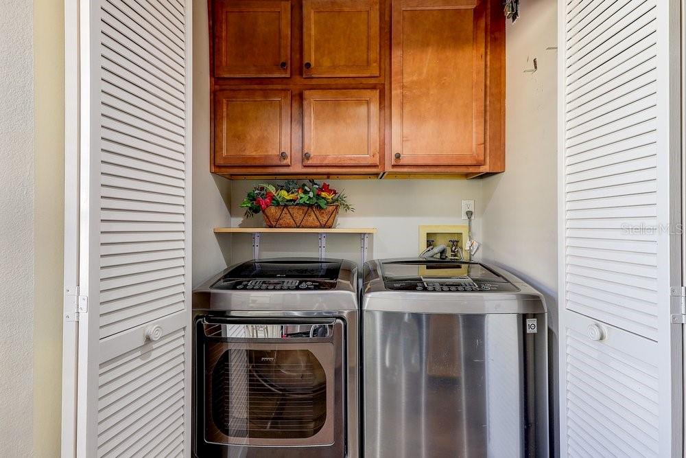 3454 Niblick Court New Port Richey, FL 34655 - Photo 16 of 54 a kitchen with stainless steel appliances granite countertop a stove and a refrigerator