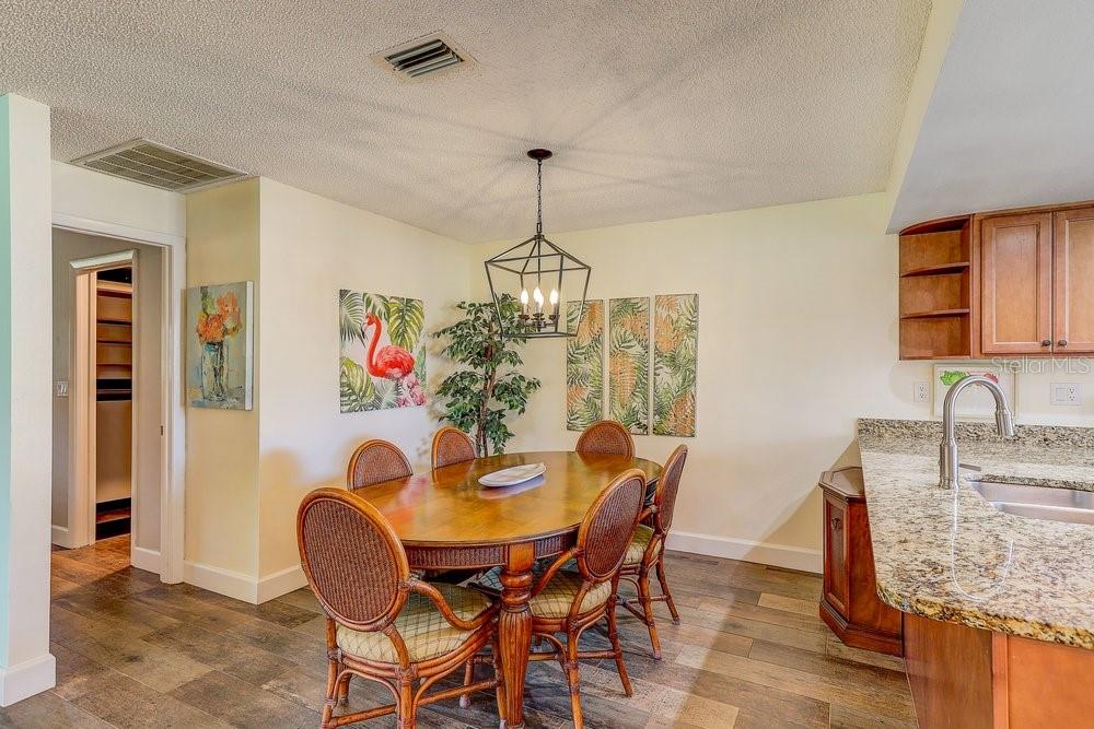 3454 Niblick Court New Port Richey, FL 34655 - Photo 18 of 54 a view of a dining room with furniture window and wooden floor
