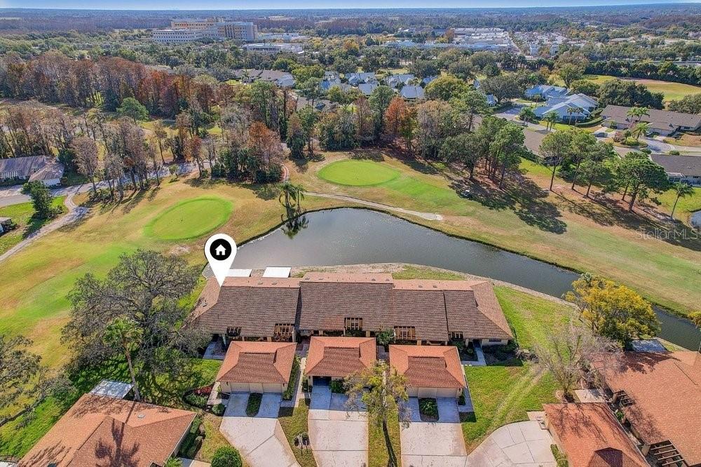 3454 Niblick Court New Port Richey, FL 34655 - Photo 2 of 54 an aerial view of a house with a swimming pool