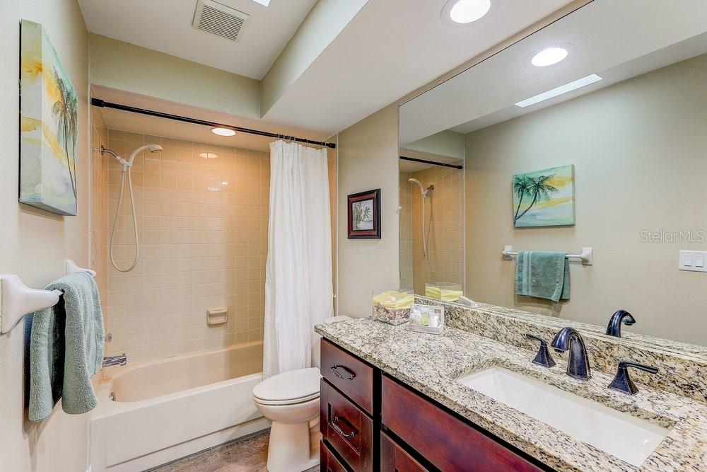 3454 Niblick Court New Port Richey, FL 34655 - Photo 34 of 54 a bathroom with a granite countertop sink toilet and shower