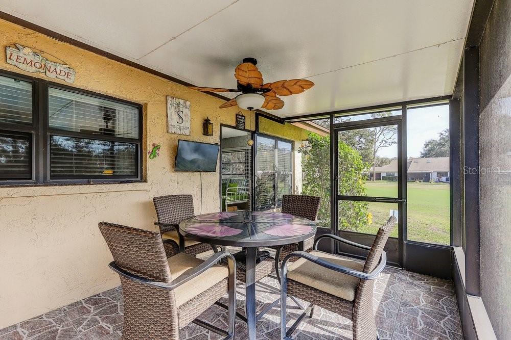 3454 Niblick Court New Port Richey, FL 34655 - Photo 35 of 54 a dining room with furniture and wooden floor