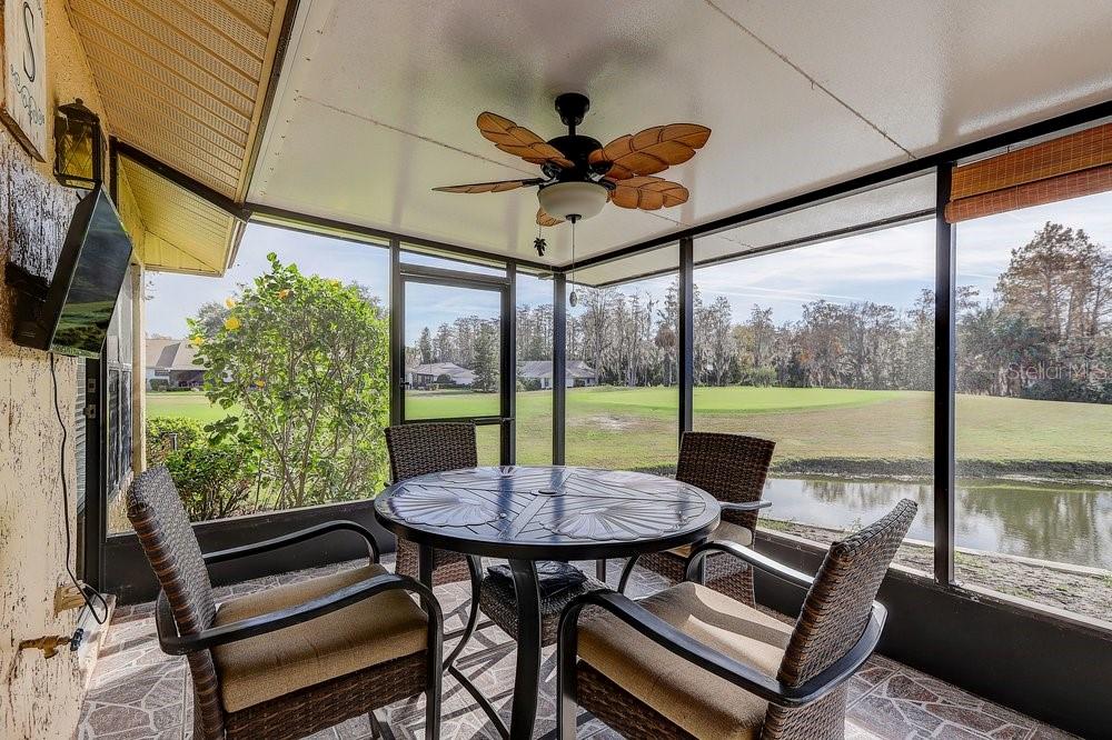 3454 Niblick Court New Port Richey, FL 34655 - Photo 37 of 54 a view of a patio with a table chairs and a table