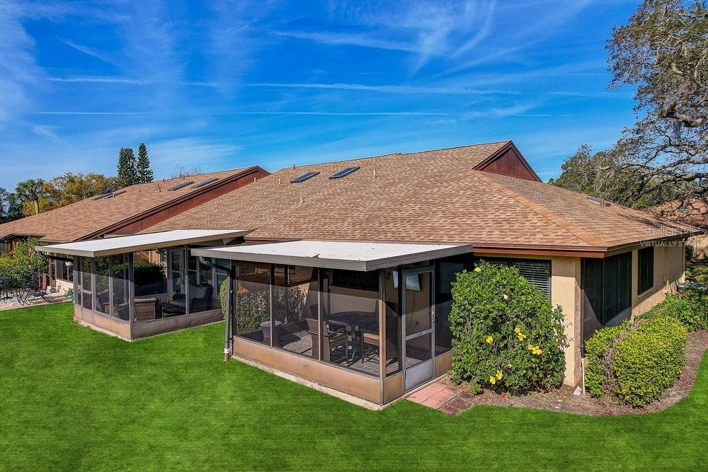 3454 Niblick Court New Port Richey, FL 34655 - Photo 38 of 54 a view of a house with a big yard potted plants and large tree