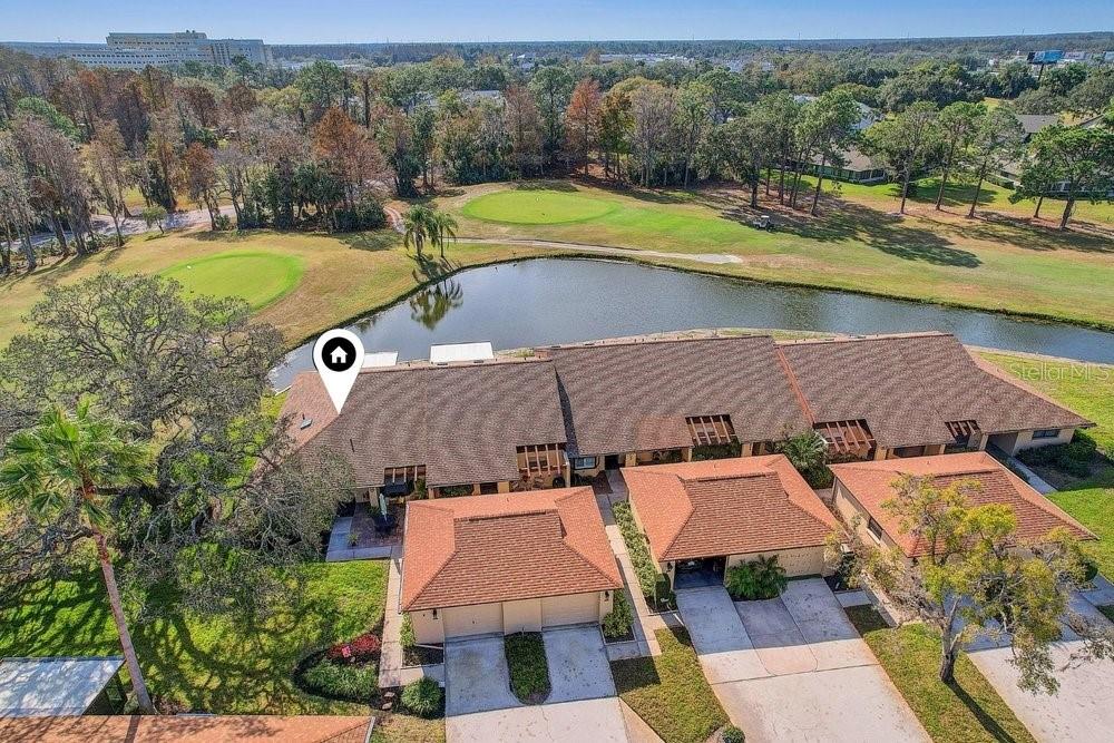 3454 Niblick Court New Port Richey, FL 34655 - Photo 41 of 54 an aerial view of a house with a swimming pool