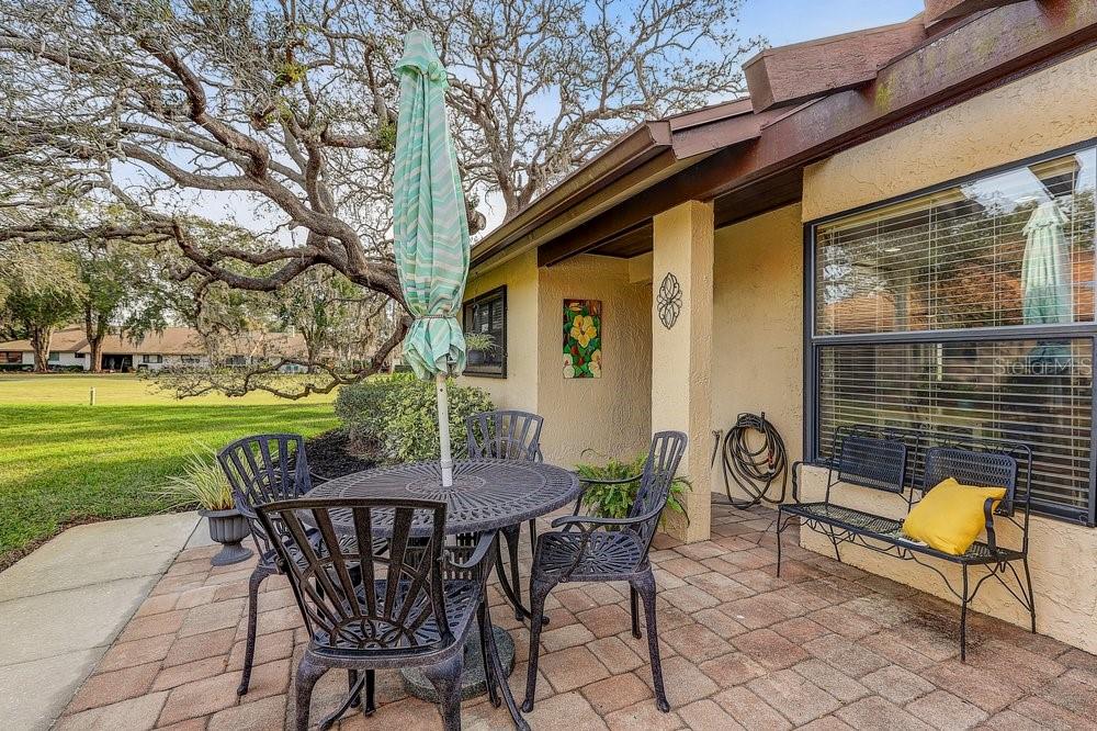 3454 Niblick Court New Port Richey, FL 34655 - Photo 7 of 54 a view of a chairs and table in backyard of the house