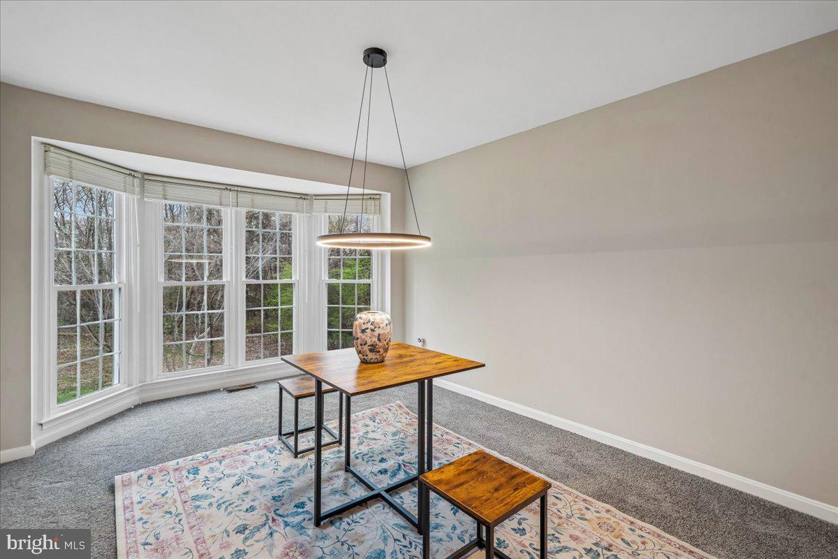 8010 Craddock Road Greenbelt, MD 20770 - Photo 13 of 49 a balcony with furniture and a window