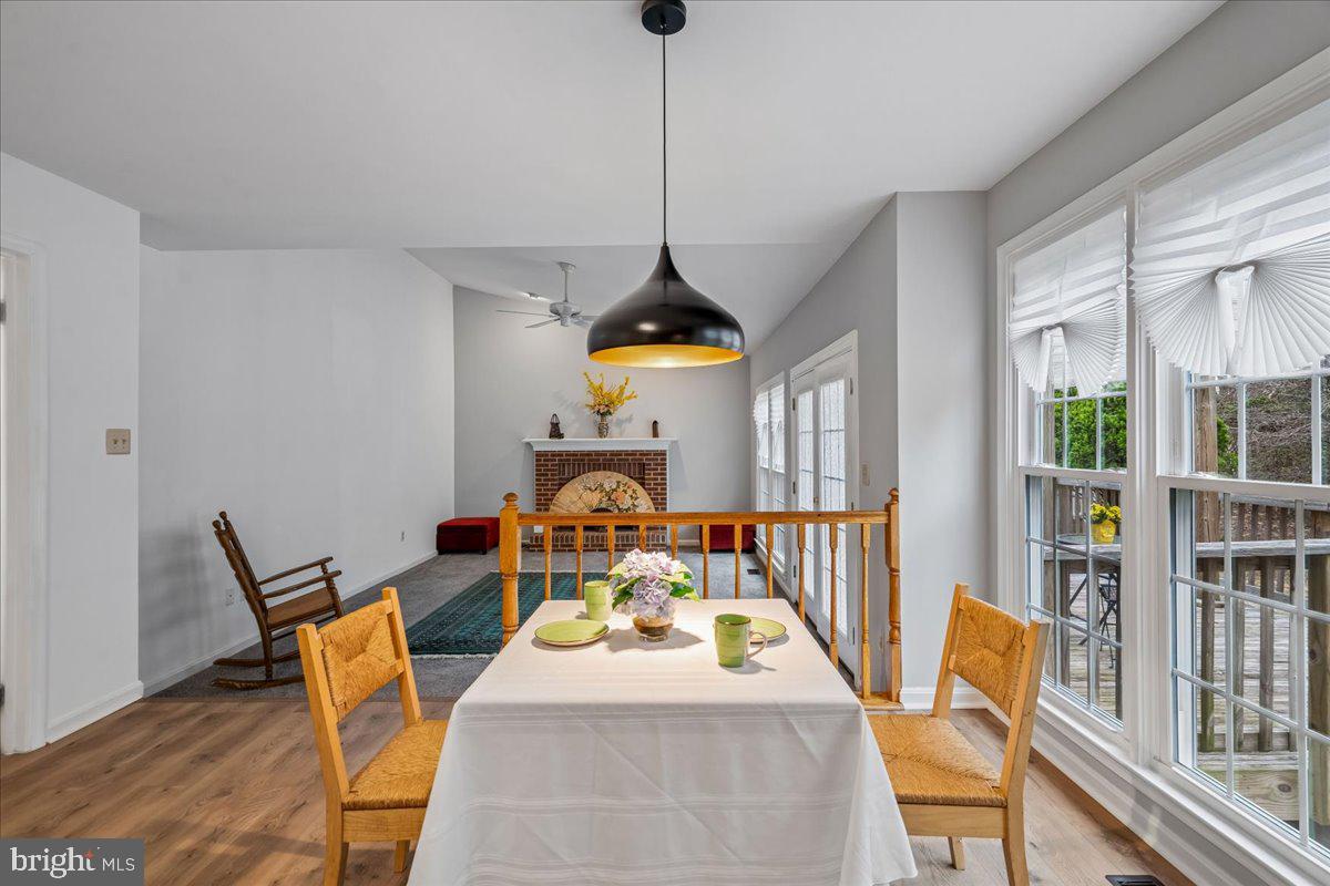 8010 Craddock Road Greenbelt, MD 20770 - Photo 20 of 49 a view of a dining room with furniture window and wooden floor