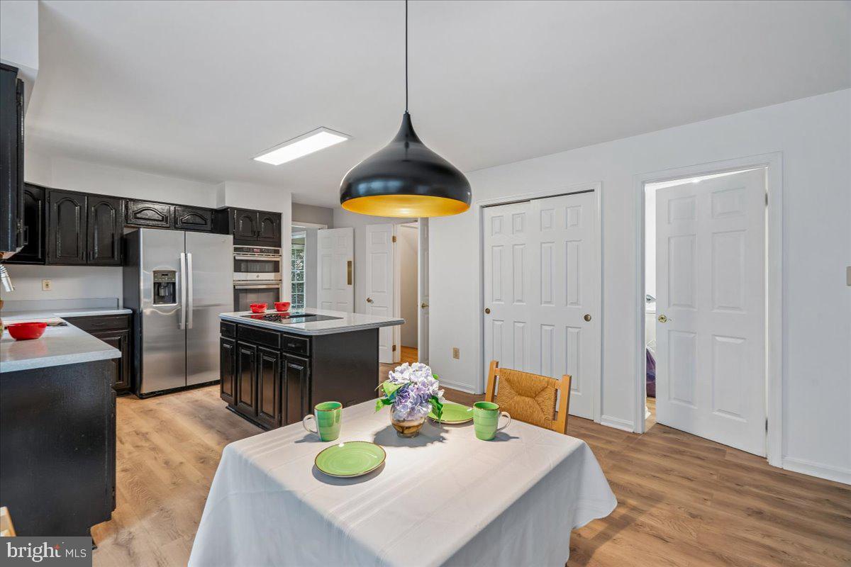 8010 Craddock Road Greenbelt, MD 20770 - Photo 21 of 49 a kitchen with a table and chairs in it