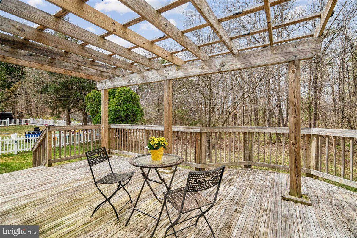 8010 Craddock Road Greenbelt, MD 20770 - Photo 27 of 49 a view of a chairs on wooden deck