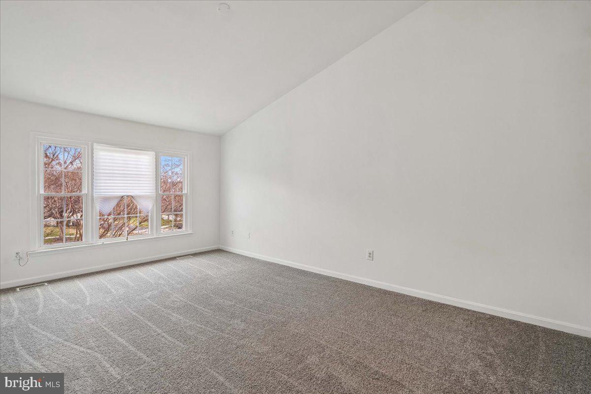 8010 Craddock Road Greenbelt, MD 20770 - Photo 28 of 49 a view of an empty room with a window