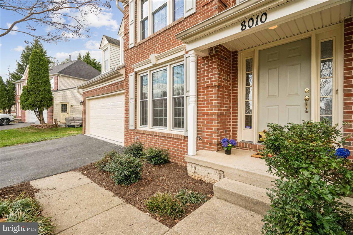 8010 Craddock Road Greenbelt, MD 20770 - Photo 3 of 49 a front view of a house with a yard