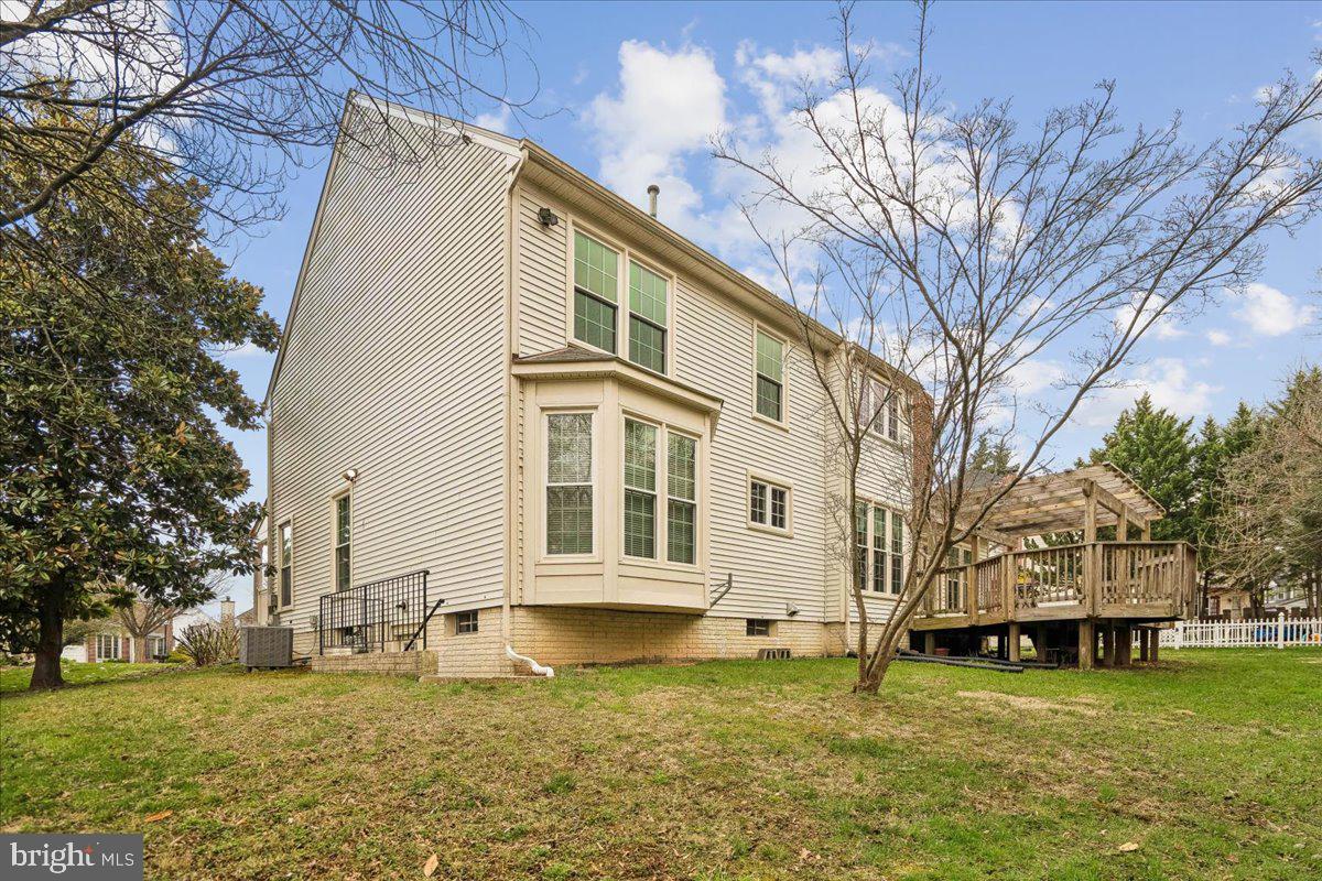 8010 Craddock Road Greenbelt, MD 20770 - Photo 45 of 49 a view of a large white house with a large tree