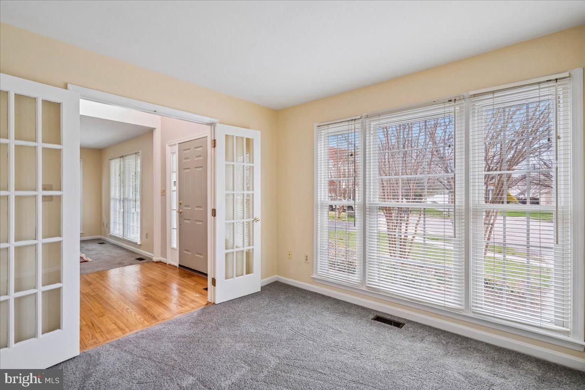 8010 Craddock Road Greenbelt, MD 20770 - Photo 7 of 49 an empty room with windows