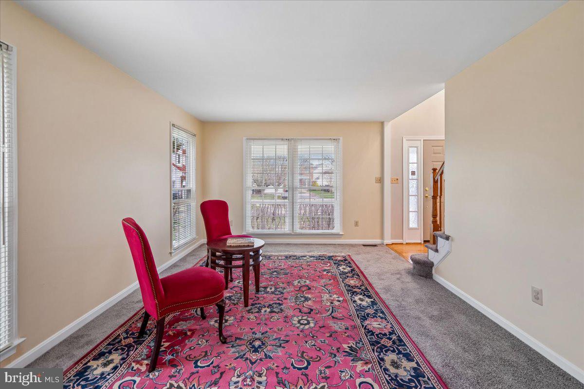 8010 Craddock Road Greenbelt, MD 20770 - Photo 9 of 49 a living room with furniture and a rug