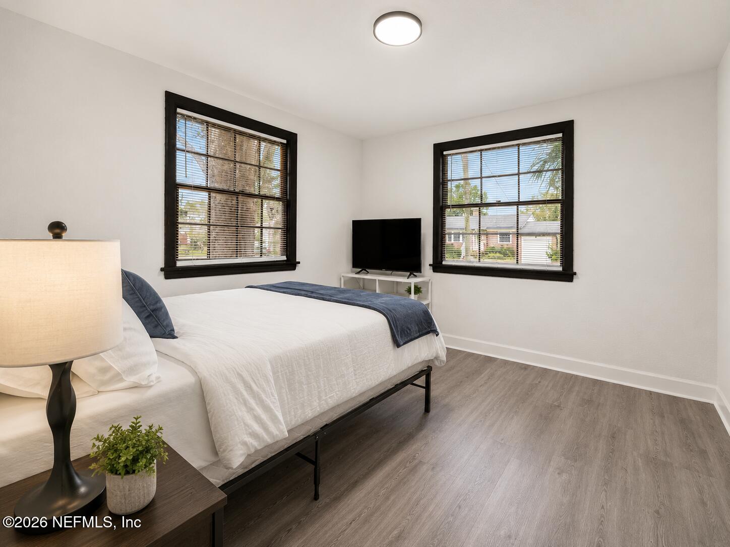 2131 Redfern Road Jacksonville, FL 32207 - Photo 13 of 13 a bedroom with a bed and wooden floor