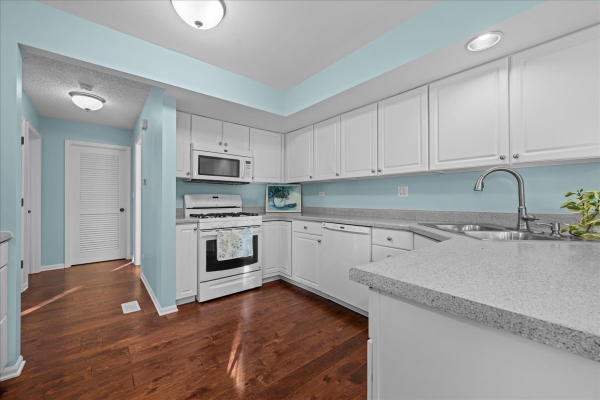 1320 Georgetown Drive Batavia, IL 60510 - Photo 11 of 21 a kitchen with granite countertop a sink and steel appliances