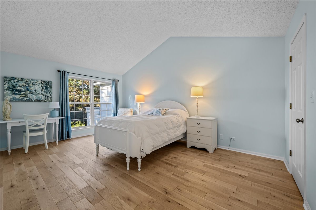 1320 Georgetown Drive Batavia, IL 60510 - Photo 18 of 21 a spacious bedroom with a bed and a table in it