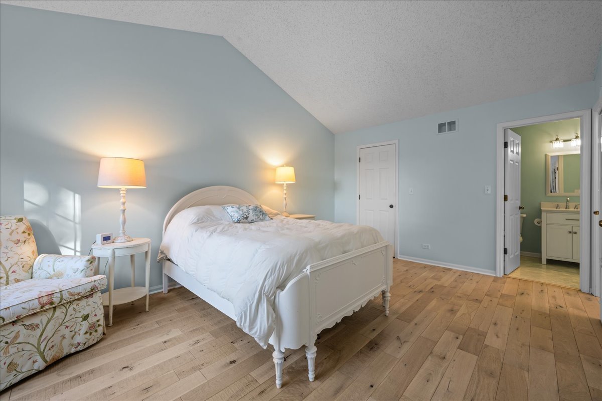 1320 Georgetown Drive Batavia, IL 60510 - Photo 19 of 21 a bed room with a bed and a night stand