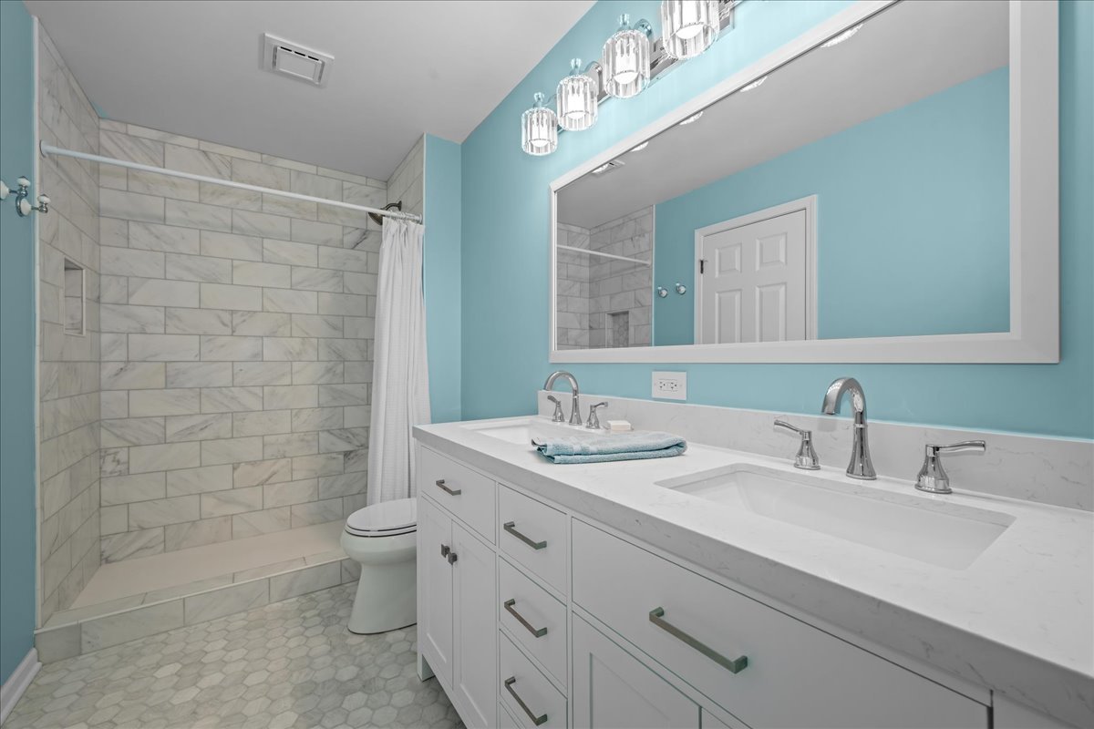 1320 Georgetown Drive Batavia, IL 60510 - Photo 20 of 21 a bathroom with a double vanity sink mirror and toilet